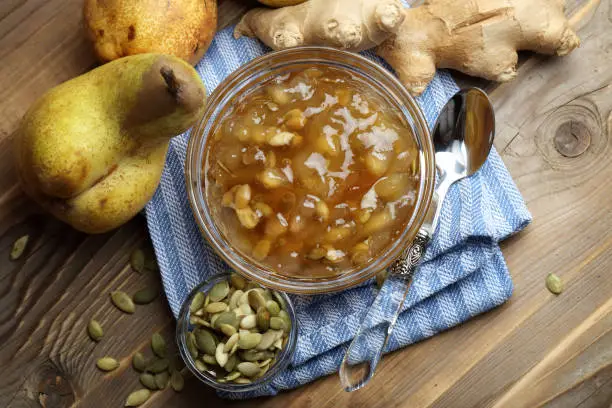 Homemade pear jam with ginger and pumpkin seeds