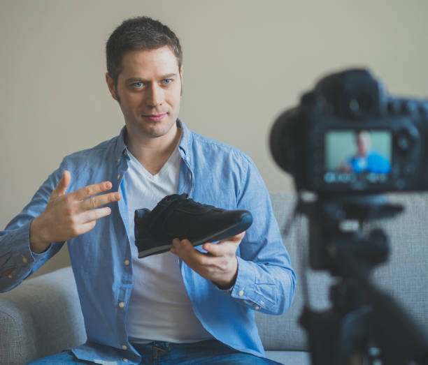 istock Handsome man making video blog about fashion. 925207870
