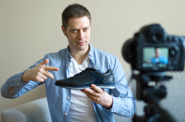 istock Handsome man making video blog about fashion. 925207874
