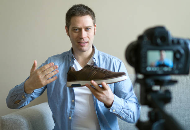 istock Handsome man making video blog about fashion. 925207884