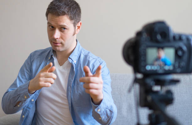 istock Handsome man making video blog. Concept of blogging. 925207946