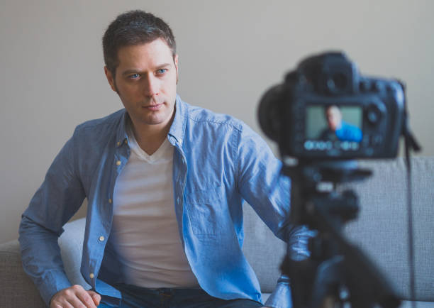istock Handsome man making video blog. Concept of blogging. 925207974