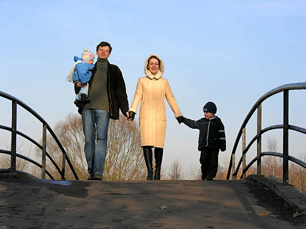 istock family of four on bridge 92520826
