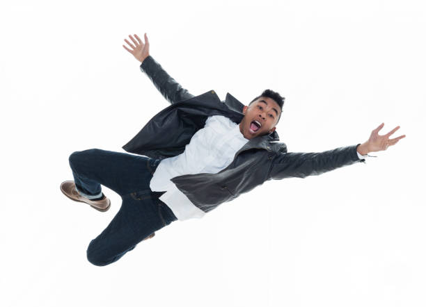 istock Daring young handsome male in mid air falling and jumping 925211718