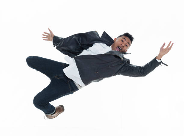 istock Daring young handsome male in mid air falling and jumping 925211836