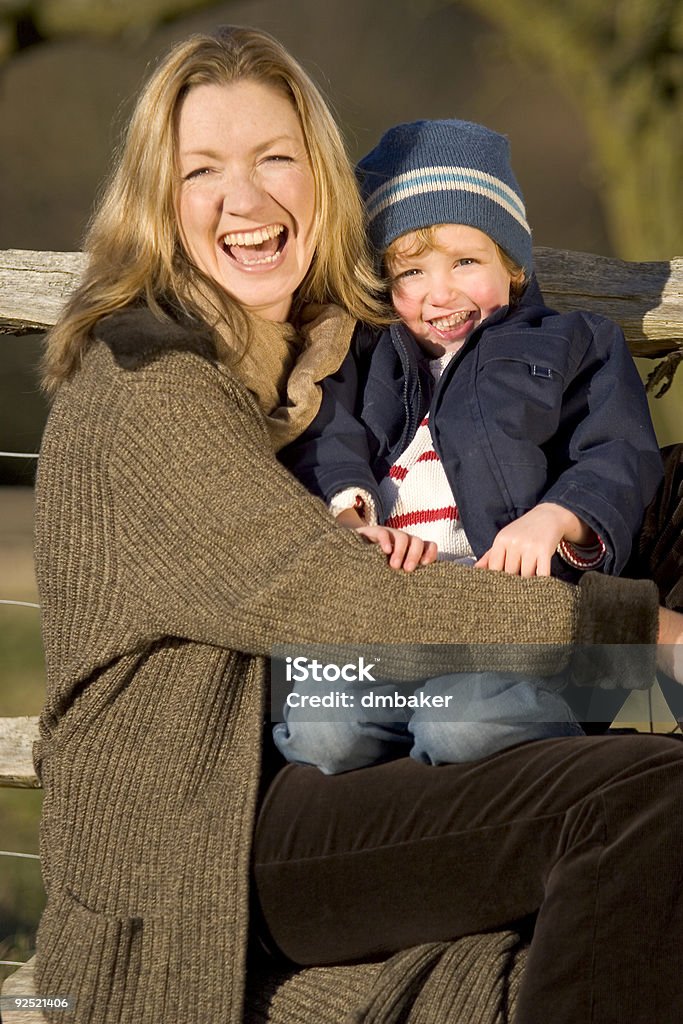 Laughing Together A mother and her young son laughing together in the English countryside 30-39 Years Stock Photo