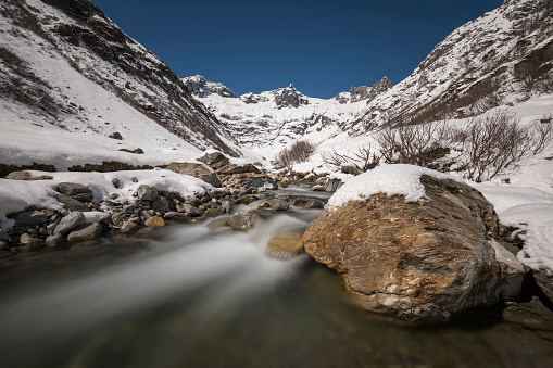 Long exposure of a creek in the Meiental in the Alps in central Switzerland