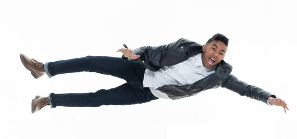 istock Daring young handsome male in mid air falling and jumping 925214664