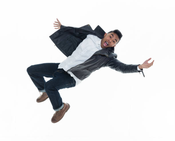 istock Daring young handsome male in mid air falling and jumping 925214678