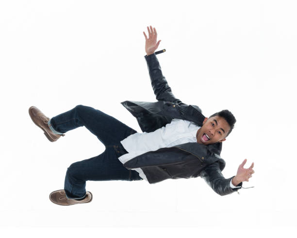 istock Daring young handsome male in mid air falling and jumping 925214924