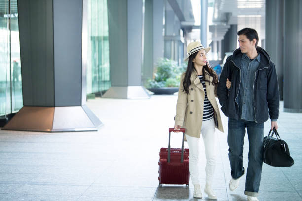 istock Men and women walking with arms folded. 925214962