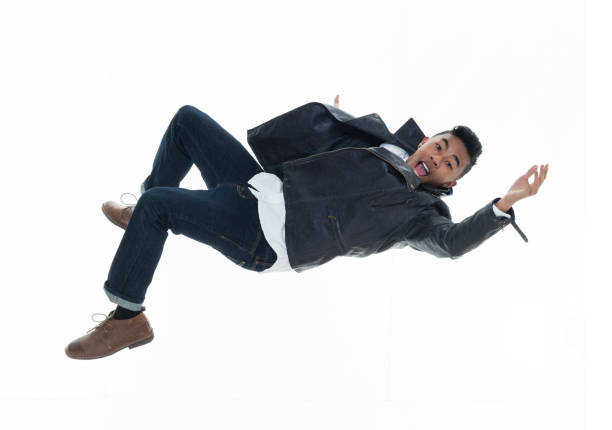 istock Daring young handsome male in mid air falling and jumping 925215522
