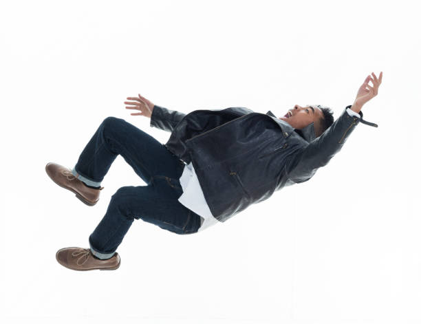 istock Daring young handsome male in mid air falling and jumping 925215742