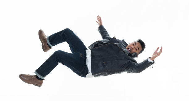 istock Daring young handsome male in mid air falling and jumping 925216098