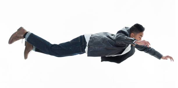 istock Daring young handsome male in mid air falling and jumping 925216188