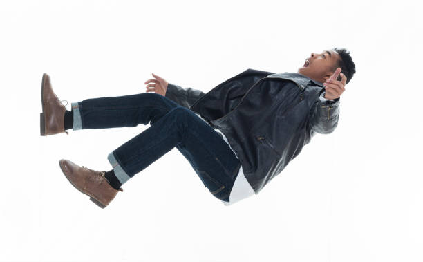 istock Daring young handsome male in mid air falling and jumping 925216194