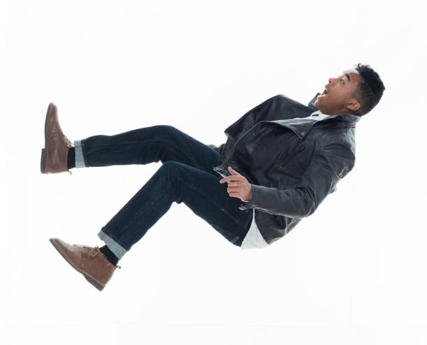 istock Daring young handsome male in mid air falling and jumping 925218600