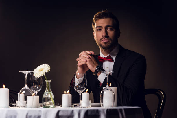 istock bearded man in jacket waiting for romantic date in restaurant 925218838