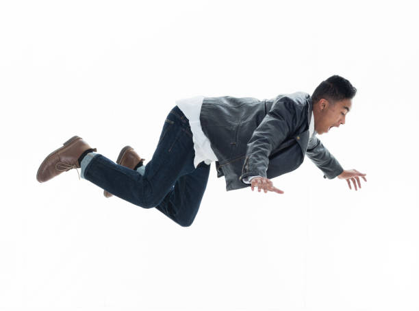 istock Daring young handsome male in mid air falling and jumping 925219034