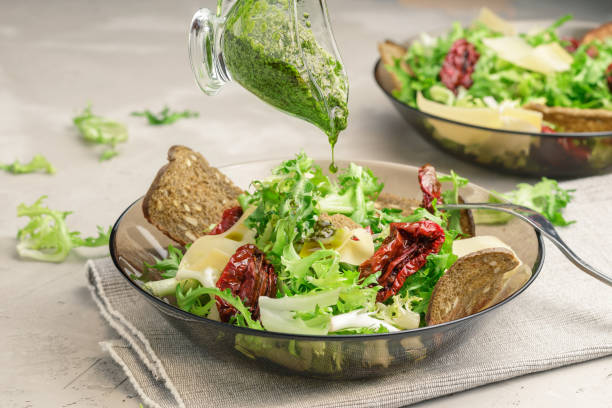 istock Frisee lettuce salad with sun dried tomatoes 925219042