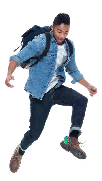 istock Good looking young man playing with foot bag (hacky sack) 925219286