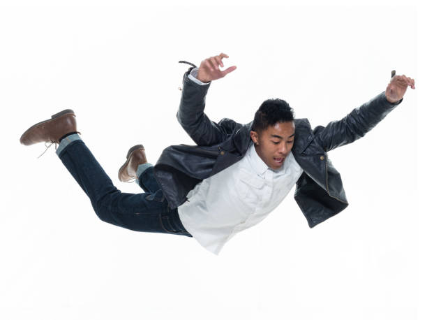 istock Daring young handsome male in mid air falling and jumping 925222438