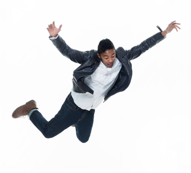 istock Daring young handsome male in mid air falling and jumping 925223530