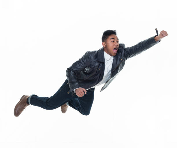 istock Daring young handsome male in mid air falling and jumping 925223534