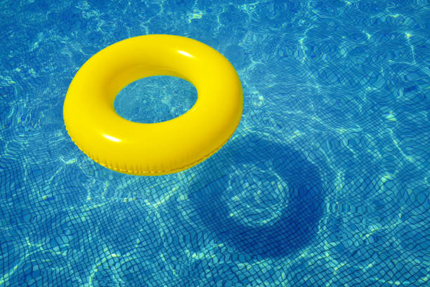istock Colorful inflatable tube in swimming pool 925224106