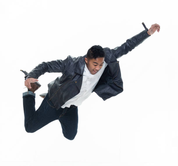 istock Daring young handsome male in mid air falling and jumping 925224356