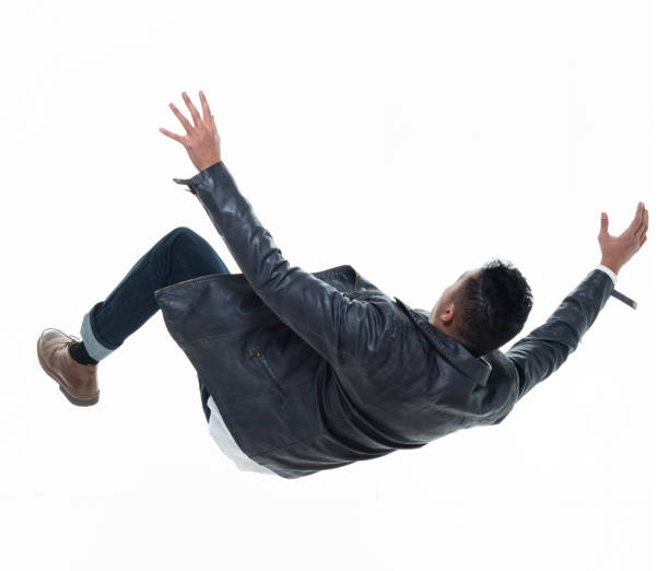 istock Daring young handsome male in mid air falling and jumping 925224466
