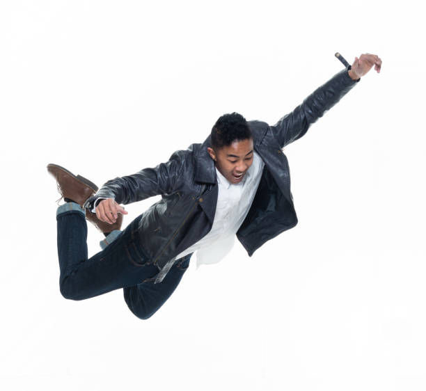 istock Daring young handsome male in mid air falling and jumping 925224472