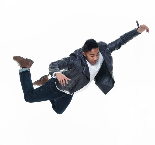 istock Daring young handsome male in mid air falling and jumping 925224548