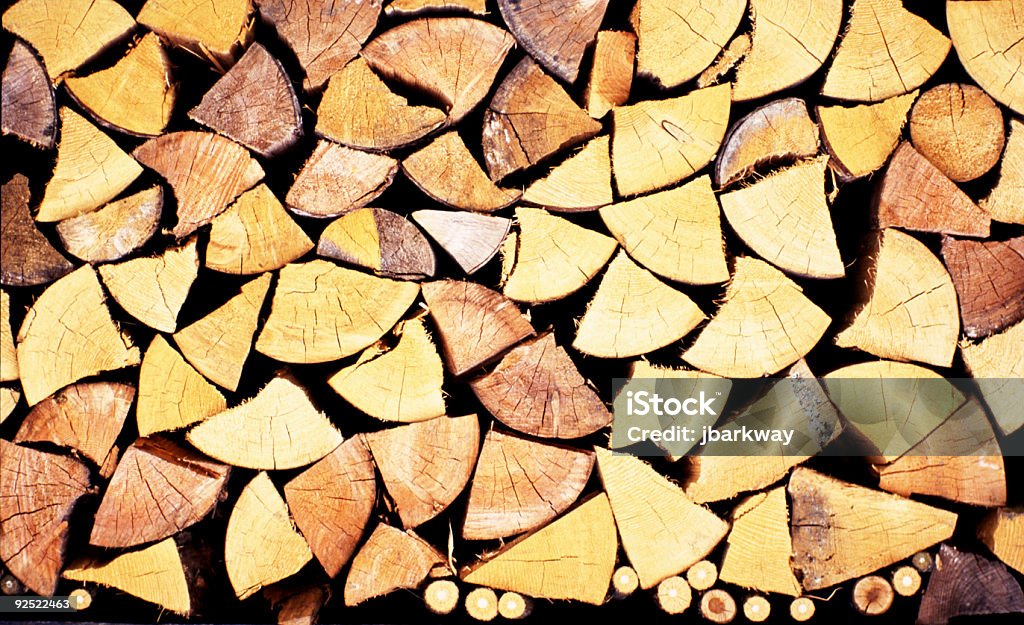 Firewood Close-up of Winter firewood stacked outside a Swiss house. Arrangement Stock Photo