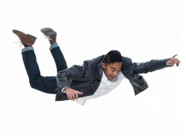 istock Daring young handsome male in mid air falling and jumping 925225894