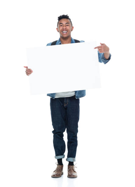 istock Handsome young male holding placard 925225900