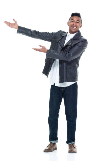 istock Handsome attractive young male pointing and presenting 925226102