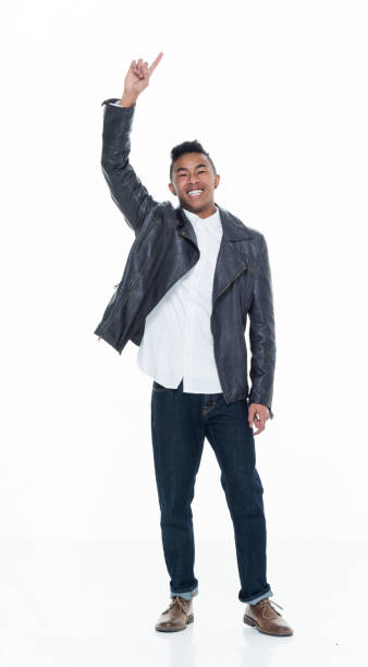 istock Handsome attractive young male pointing and presenting 925232024