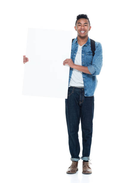 istock Handsome young male holding placard 925233058