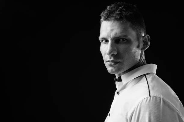 Black and white portrait of young man. Studio shot.