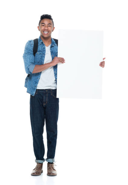 istock Handsome young male holding placard 925235528