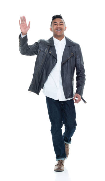 istock Good looking young man walking and waving 925235852
