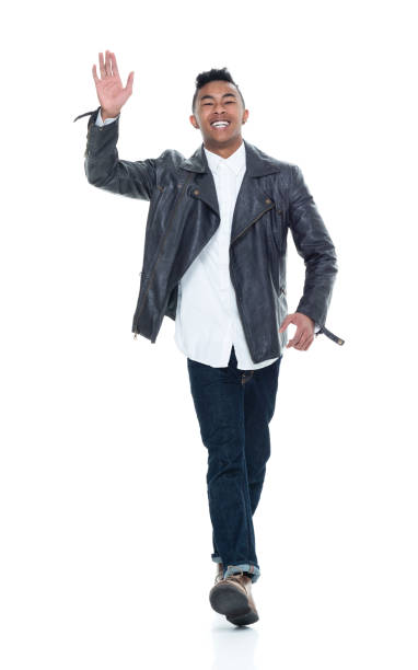 istock Good looking young man walking and waving 925235854