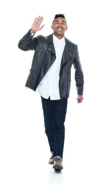 istock Good looking young man walking and waving 925235984