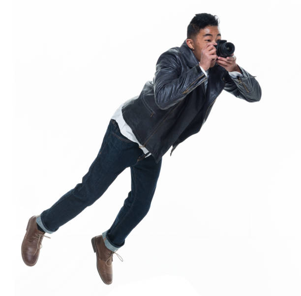 istock Daring young handsome male in mid air falling and jumping 925236206