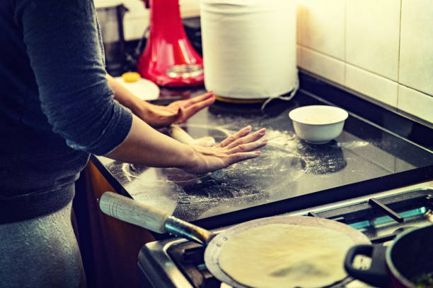istock Evenly spreading the pressure with the rolling pin. 925236710