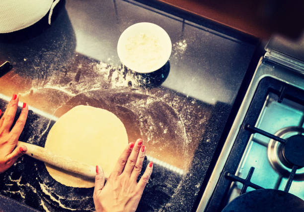 istock Rolling out new chapatis ising more flour to even it all out. 925236844