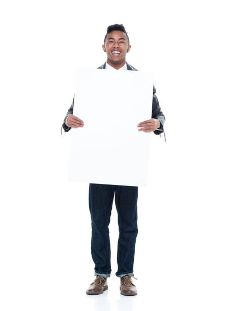 istock Dashing young man holding a placard 925236864
