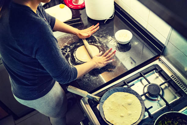 Applying even pressure to the chapati