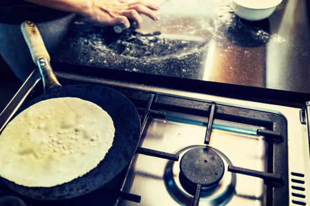 istock Chapati cooking on a preheated pan 925237130